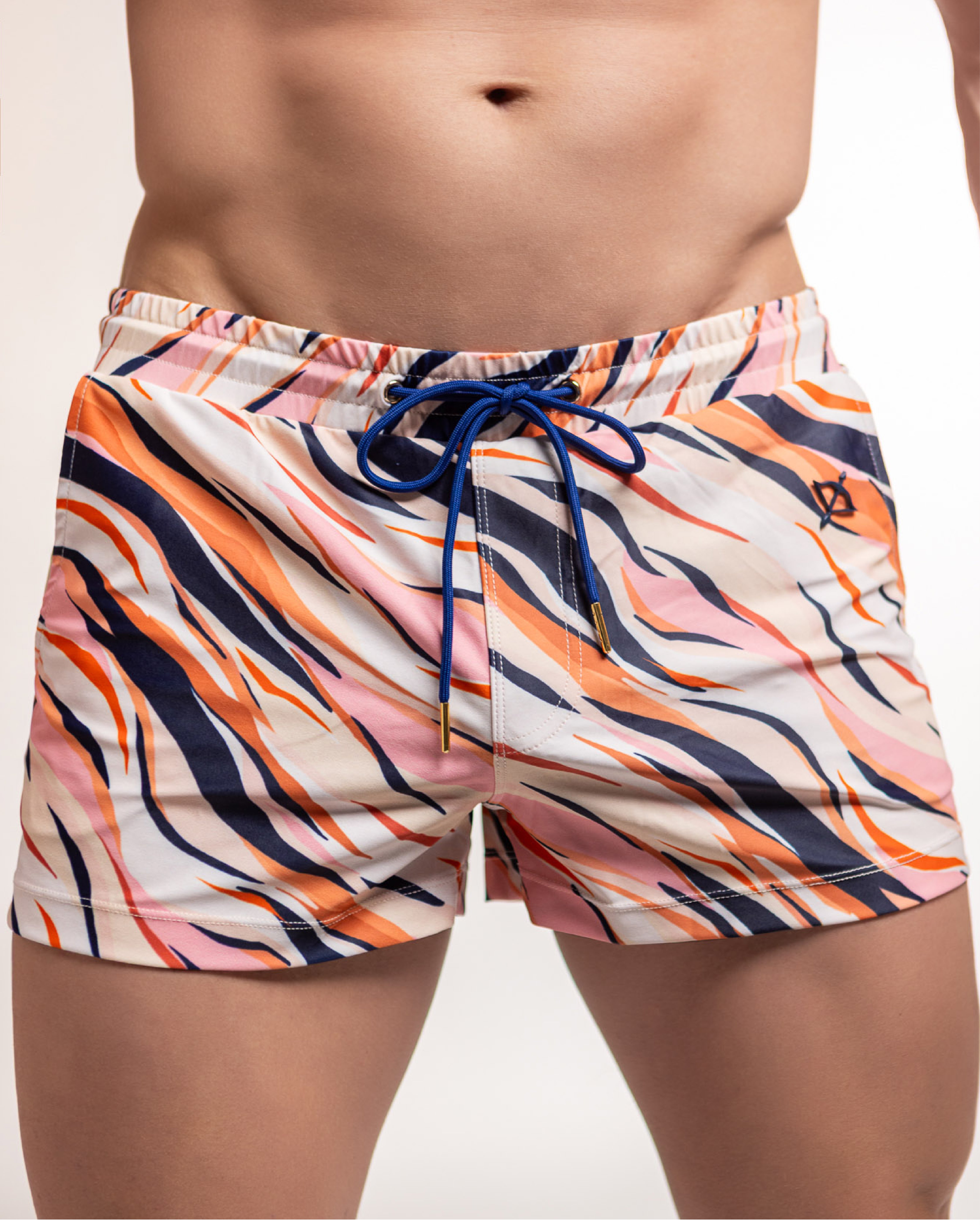 Multicolored swim shorts with a drawstring on a neutral background
