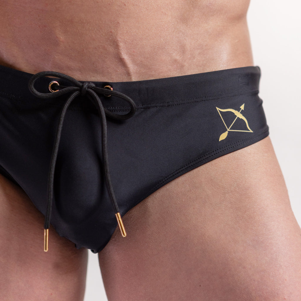 Black swimwear brief in midnight black colour gold logo