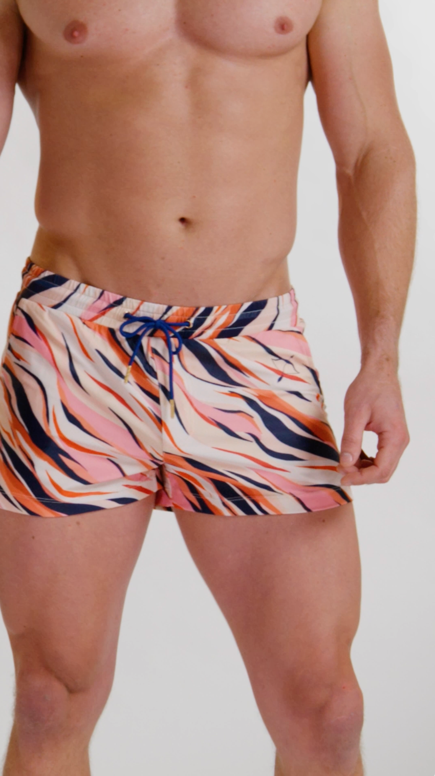 Load video: Model showcasing the tiger brief swim short
